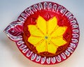 Closeup shot of a red and yellow Festival Diya Set for Decoration. Handmade Clay Diya for Diwali