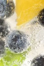 Closeup shot of a refreshing drink with fresh blueberries and ice cubes Royalty Free Stock Photo