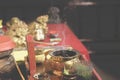 Closeup shot of religious Buddhist bowl smoking incense during a ritual