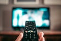 Closeup shot of a remote controller for a modern TV in a hand Royalty Free Stock Photo