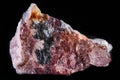 Closeup shot of Rhodochrosite mineral on an isolated black background