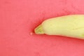 Closeup shot of ripe zucchini on a pink surface Royalty Free Stock Photo