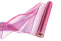 Closeup shot of a roll of pink fabric isolated on a white background