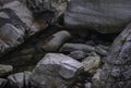 Closeup shot of rough rugged rock pieces on a ground