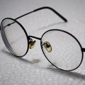 Closeup shot of round-framed glasses Royalty Free Stock Photo