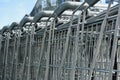 Closeup shot of a row of metal shopping carts Royalty Free Stock Photo