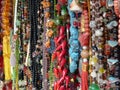 Closeup shot of rows of colorful beaded jewelry in a market