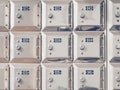 Closeup shot of rows of small silver numbered lockers