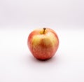 Closeup shot of a royal gala apple against a white background Royalty Free Stock Photo