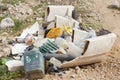 Closeup shot of rubbish with lots of plastic bottles thrown away in the field