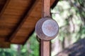 Closeup shot of a rusty old bucket hanging on a wooden pole Royalty Free Stock Photo