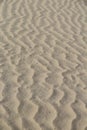 Closeup shot of the sand of the beach with interesting patterns - perfect for background Royalty Free Stock Photo