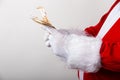 Closeup shot of Santa Claus holding euro bills Royalty Free Stock Photo