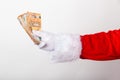 Closeup shot of Santa Claus holding euro bills Royalty Free Stock Photo