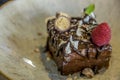 Closeup shot with selective focus of chocolate cake with raspberry