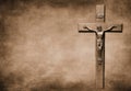Closeup shot of a Sepia-toned crucifix with the body of Christ on a large background Royalty Free Stock Photo