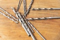 Closeup shot of a set of drills on a wooden surface Royalty Free Stock Photo