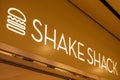 Closeup shot of the Shake Shack logo at a shopping mall in Hong Kong