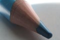 Closeup shot of a sharpened blue pencil tip