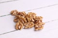 Closeup shot of a shelled walnut pile on a white background Royalty Free Stock Photo