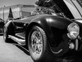 Closeup shot of a shiny black AC Cobra at Classic Car Show in Woodinville, Washington, in grayscale Royalty Free Stock Photo