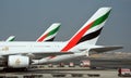 Closeup shot of a side view of Emirates Airlines aircraft parked on the stand at Dubai Airport