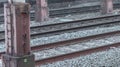 Closeup shot of a sign of "no litter please" on a metal pole in a railway station