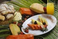 Closeup shot of sliced pineapple, papaya, melon, strawberries,