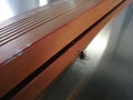 Small black spider on a gray shiny surface