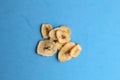 Closeup shot of small pieces of dried fruit on a monochrome background