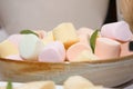 A closeup shot of soft pastel colored marshmallows.