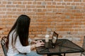 Closeup shot of a South Asian young woman working with the computer in the cafe