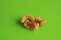 Closeup shot of Spanish Torreznos on a green background Royalty Free Stock Photo