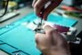 Closeup shot of a specialist repairing a mobile phone