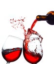 Closeup shot of splashing red wine in glasses Royalty Free Stock Photo