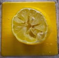Closeup shot of a squeezed half lemon