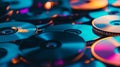 A closeup shot of a stack of CDs on a blue background The CDs are shiny and reflective creating a sense of nostalgia and Royalty Free Stock Photo