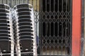 Closeup shot of a stack of chairs in front of a closed restaurant during the pandemic lockdown