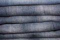 Closeup shot of stack of folded white jeans in fashion store. Shopping and clothing industry concepts Royalty Free Stock Photo