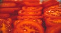 Closeup shot of a stack of freshly cut tomatoes in a restaurant