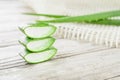 Closeup shot of a stack of sliced fresh aloe vera slices on a wooden table