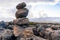 Closeup shot of a stack of zen stones  in a beautiful landscape of Tanzania and Kenya Royalty Free Stock Photo