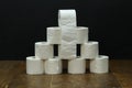Closeup shot of stacked toilet paper on a black background Royalty Free Stock Photo