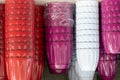 Closeup shot of stacks of colorful flowerpots on a shelf