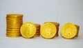 Closeup shot of stacks of gold coins isolated on a white background
