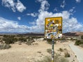 Closeup shot of stickers on a sign in the desert of Utah