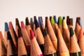 Closeup shot of a stock of colorful wooden pencils on the white background