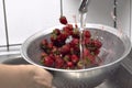 Closeup shot of the strawberries in the process of rinsing Royalty Free Stock Photo