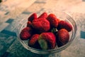 Closeup shot of strawberries in a transparent bowl Royalty Free Stock Photo