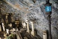 Closeup shot of a street lamp and ruins in a cave in Stockholm, Sweden